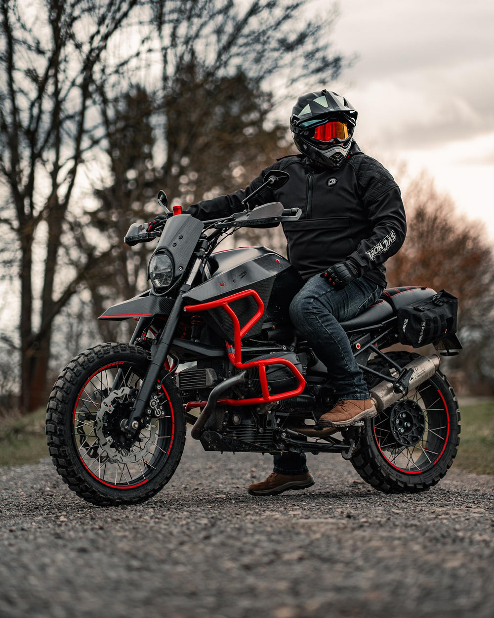 IRON JIA'S rider wearing jacket on bike demonstrating fit and practical protection