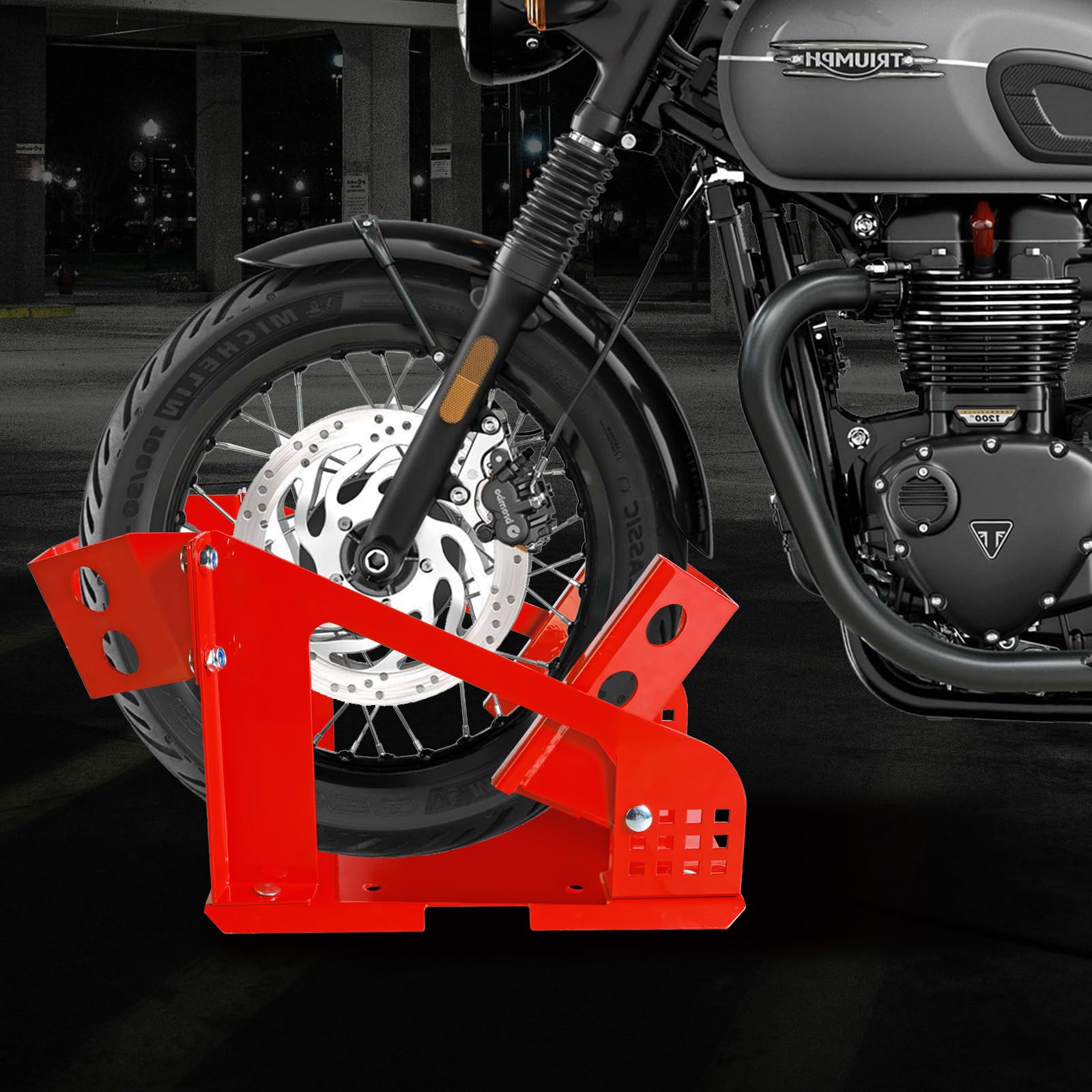 Jack Boss next to motorcycle wheel showing scale and fitment benefit
