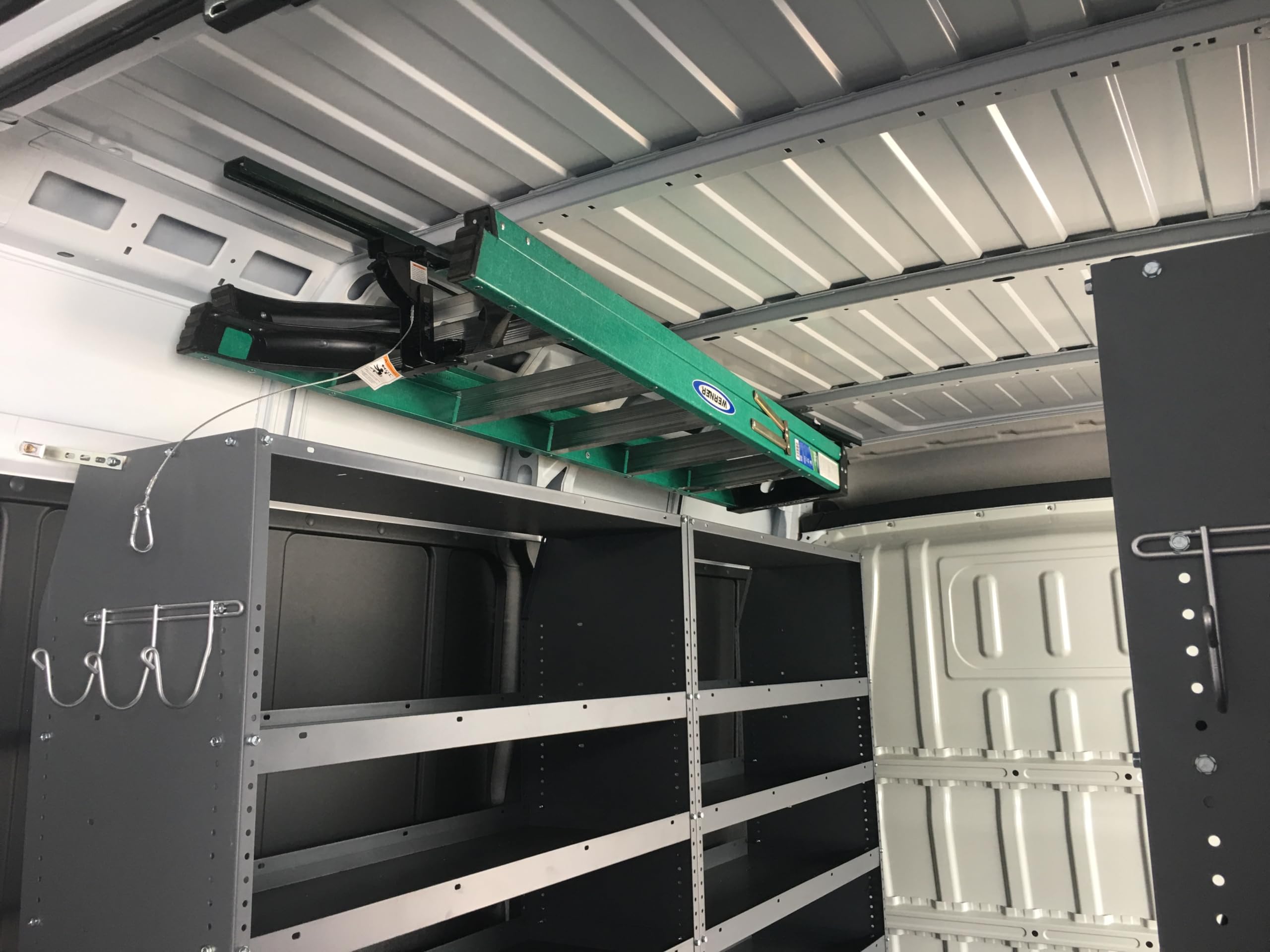 JET Rack beside a folded A-frame ladder showing space-saving scale benefit