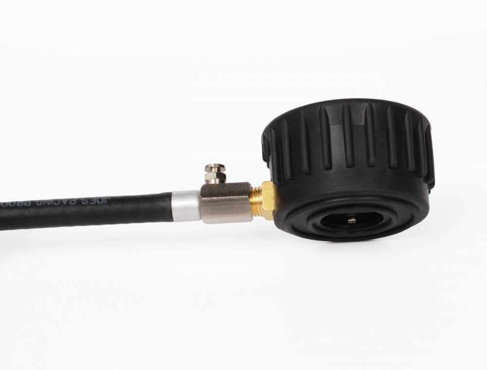Joes Racing gauge attached to tire valve demonstrating easy, repeatable checks