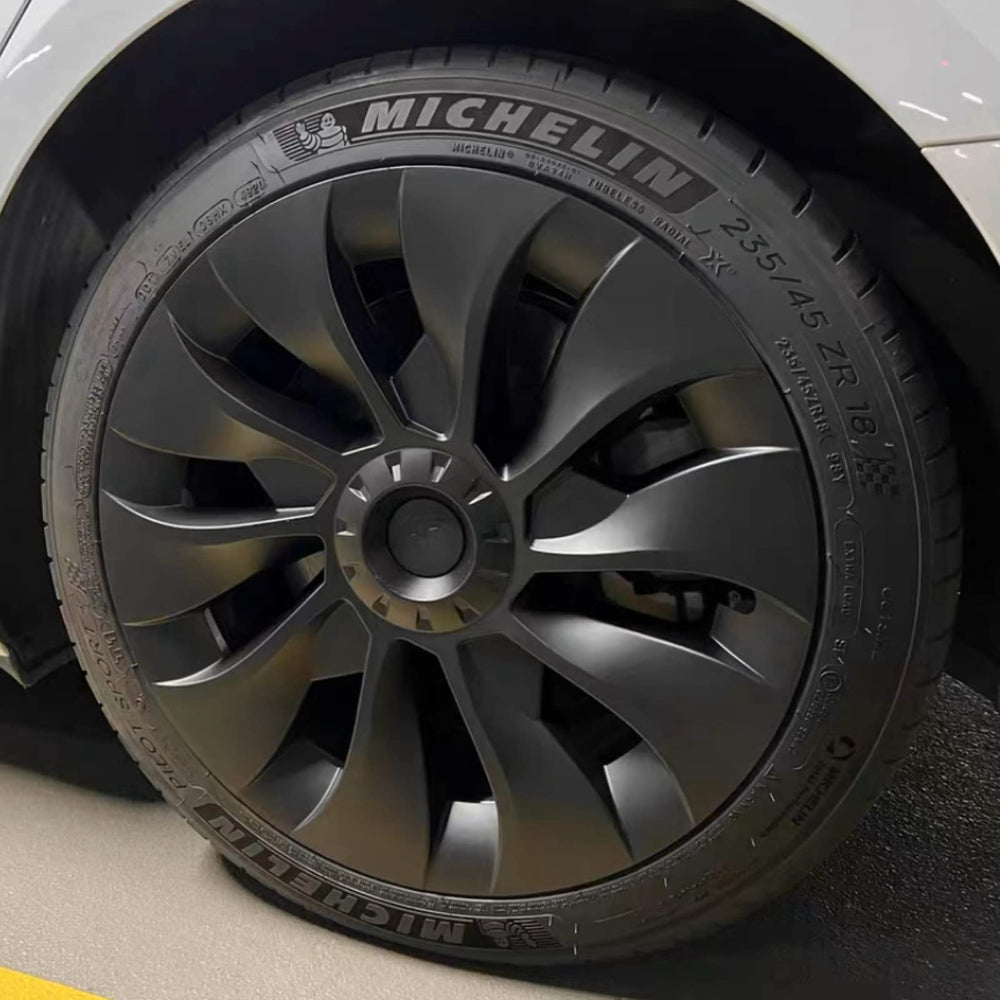 KAVANIC front view of four matte black wheel covers showing modern turbine styling and protection