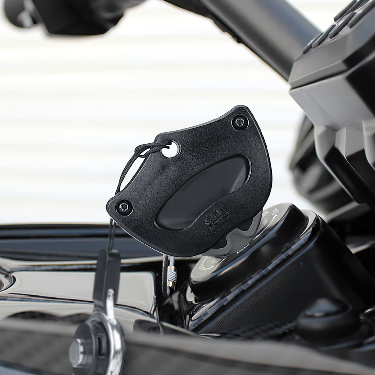 KEMIMOTO worn on wrist while handling helmet showing easy access and safety