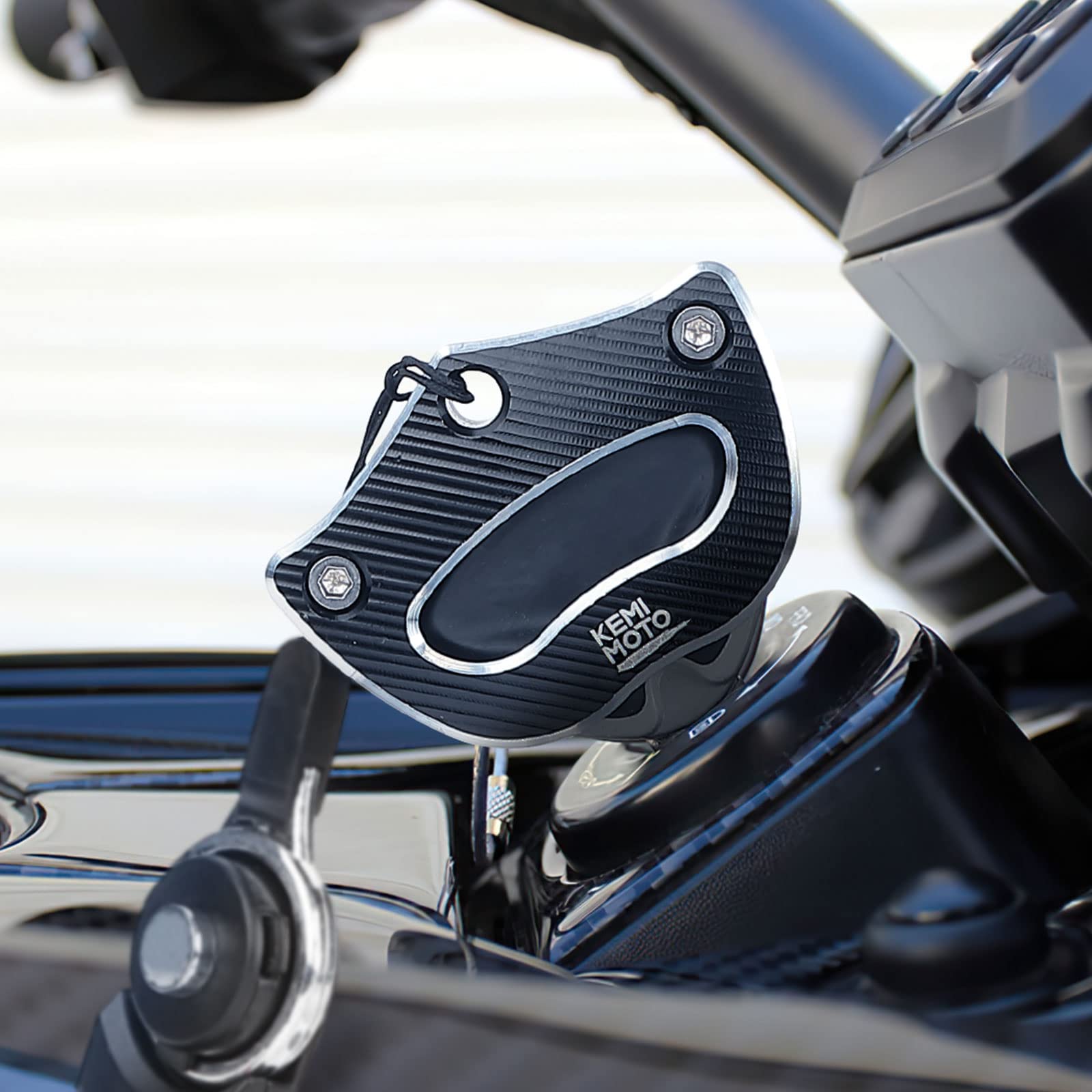 KEMIMOTO key holder in helmet pocket illustrating convenient, secure storage