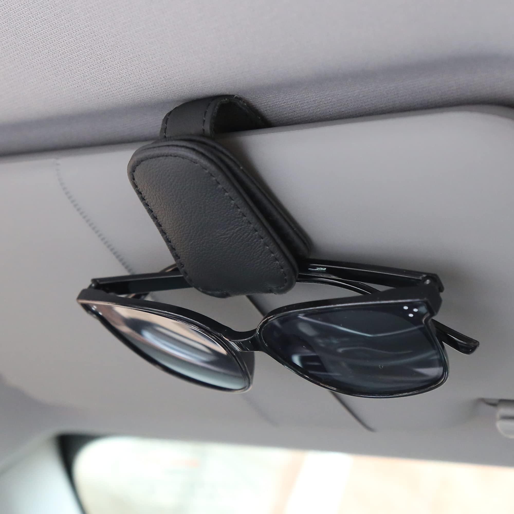 KIWEN front view of four black sunglass holders showing compact design and neat storage
