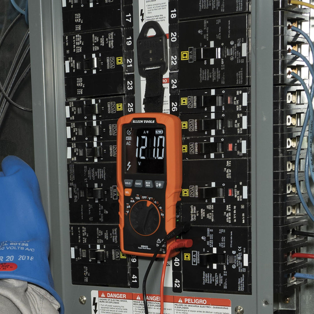 Klein Tools MM450 in technician hands measuring AC voltage for fast diagnostics