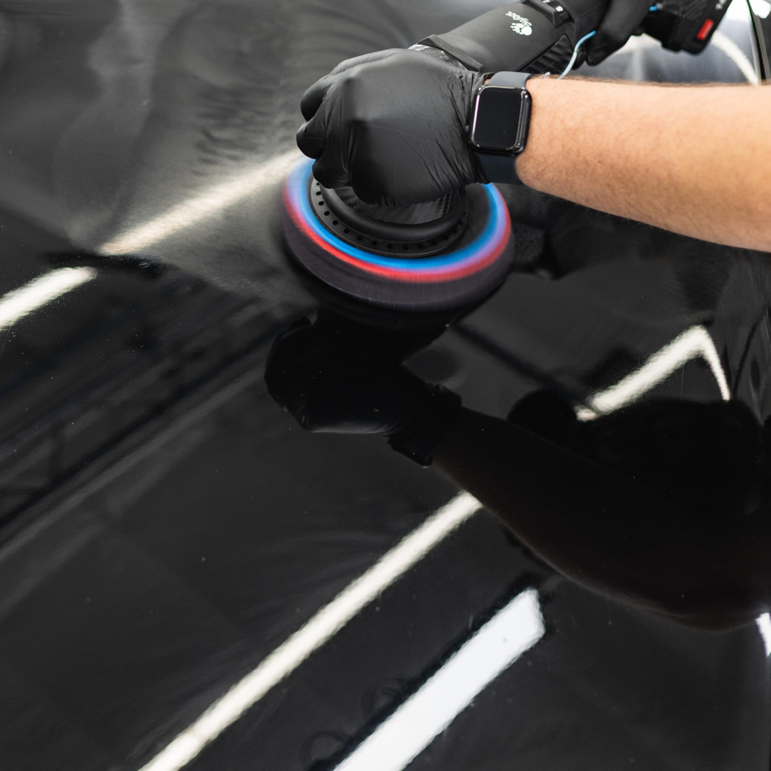 KOCHCHEMIE H9.02 bottle mounted on a polisher demonstrating professional usability