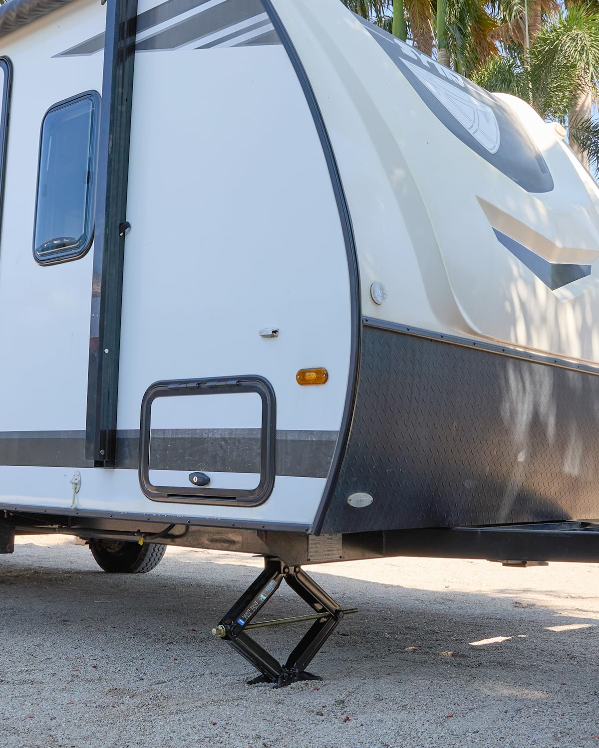 Kohree jacks stabilizing a campsite RV showing comfortable stationary camping benefit