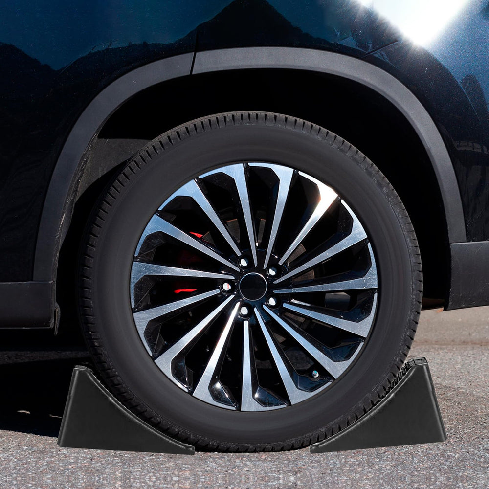 Komokeru wheel chock placed against an RV tire demonstrating secure immobilization while parked