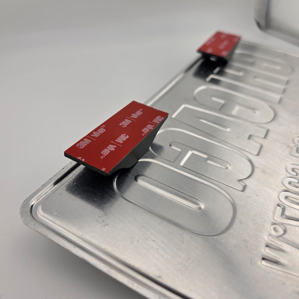 Kozomotive retail packaging and included mounts showing ready-to-install benefit