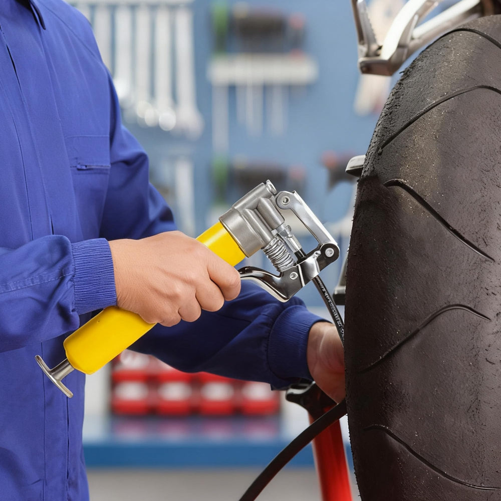 KRETLAW grease gun attached to vehicle zerk fitting for precise lubrication