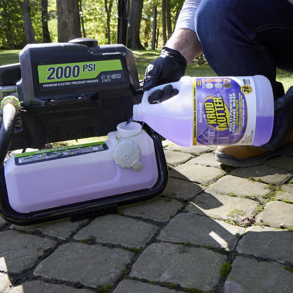 Krud Kutter applied with pressure washer cleaning patio surface for faster restoration