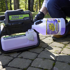 Krud Kutter applied with pressure washer cleaning patio surface for faster restoration
