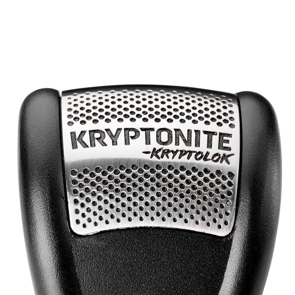 Kryptonite disc lock on street-parked motorcycle in urban setting, showcases real-world deterrence
