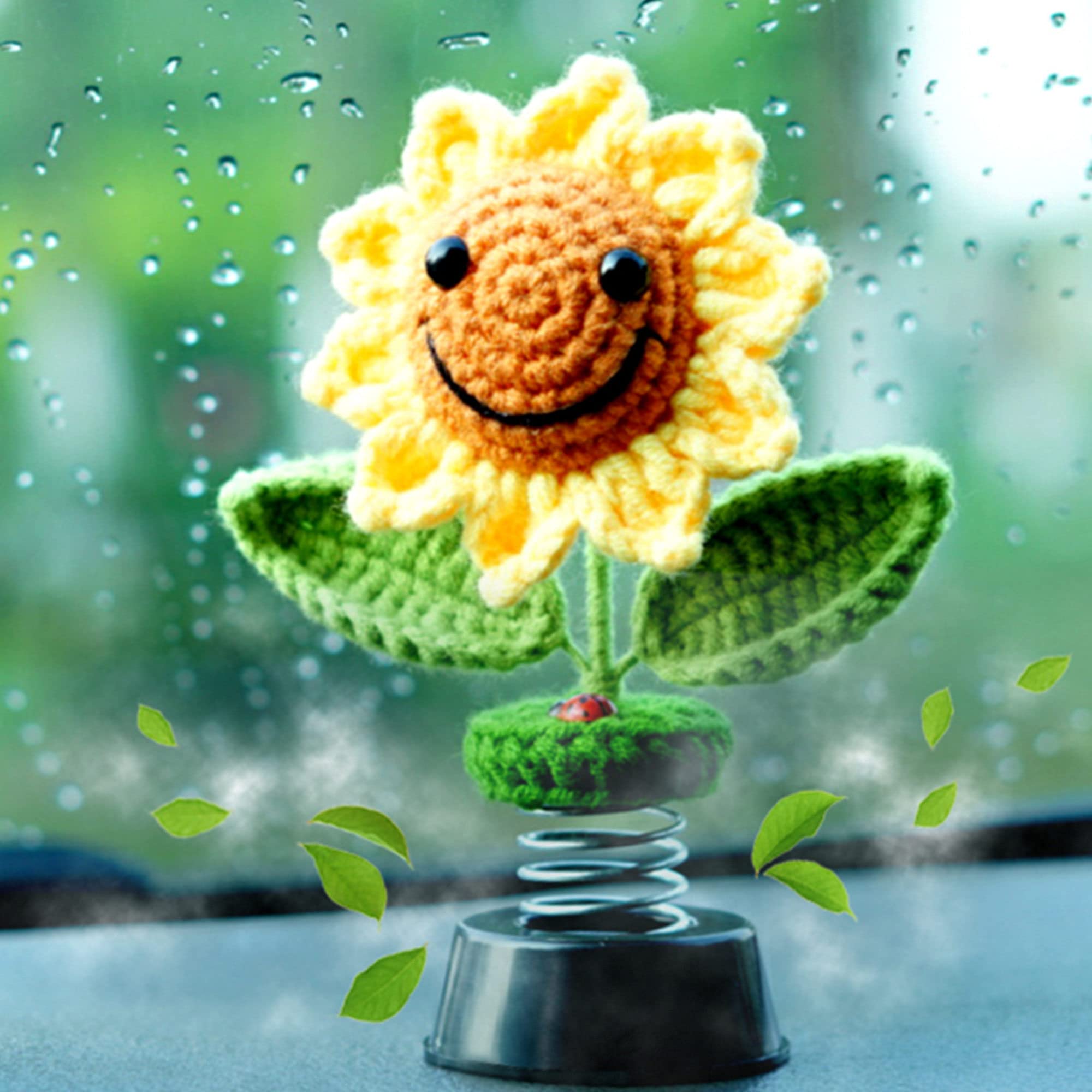 Levvohd front view of crochet sunflower bobblehead showing cute smile and bright colors