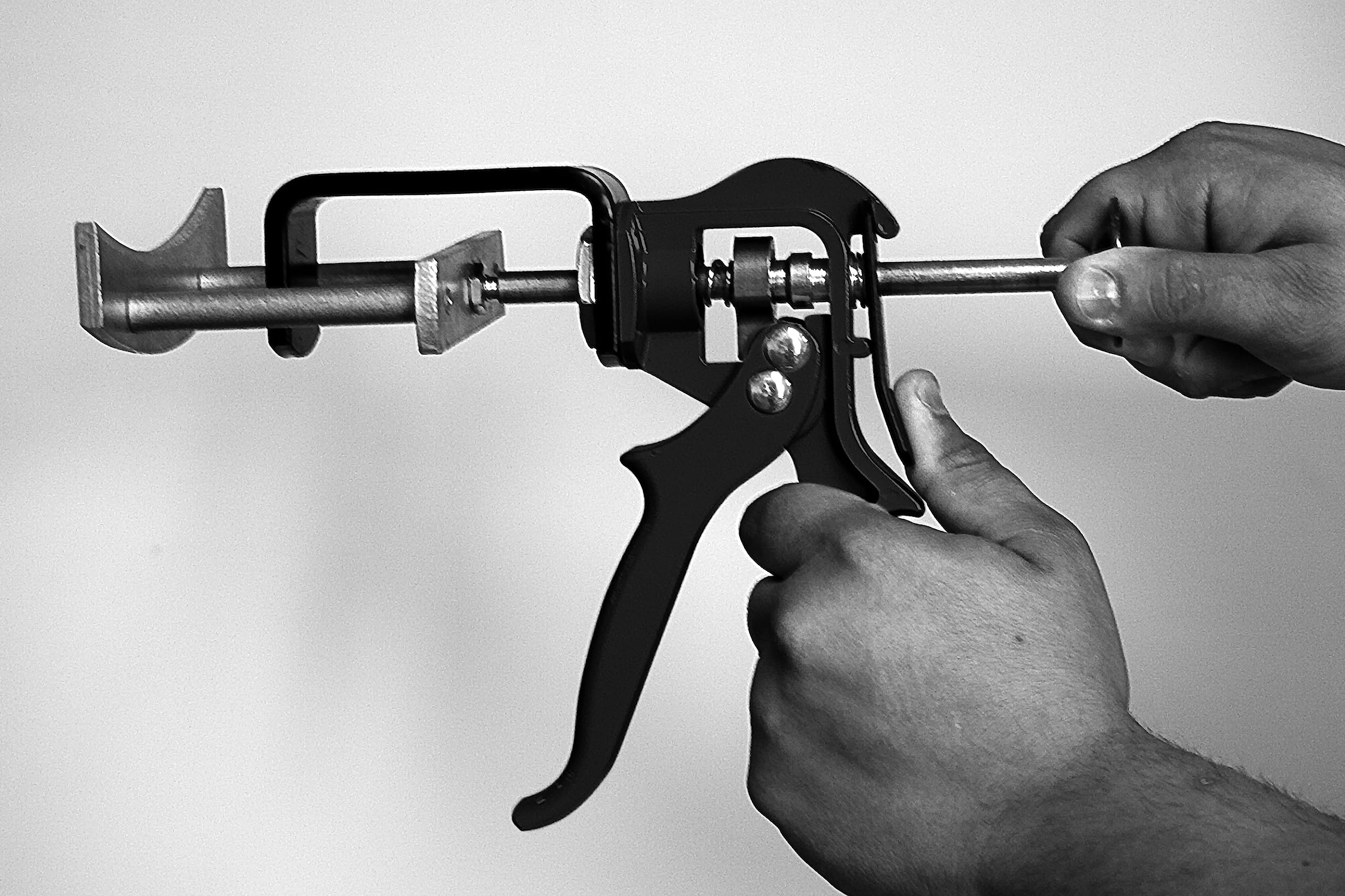 Lisle 25750 in use on caliper speeds dual-piston pad replacement