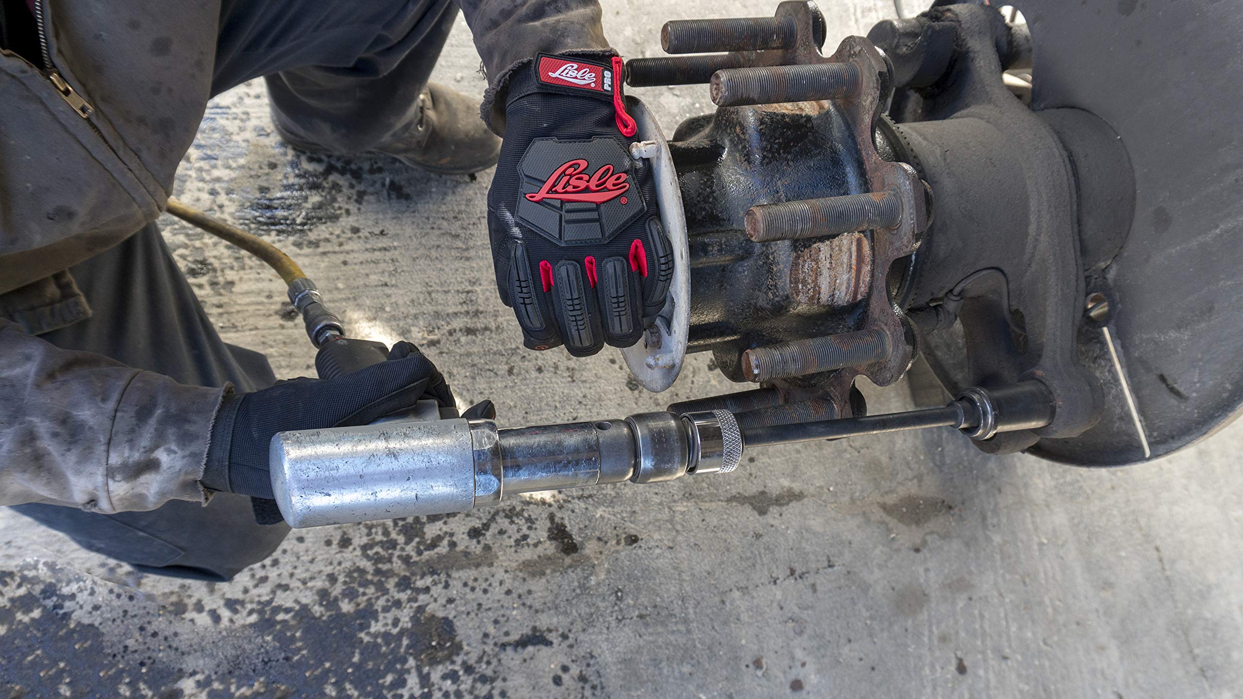 Lisle 29090 in use on truck anchor pin, speeds bushing removal safely