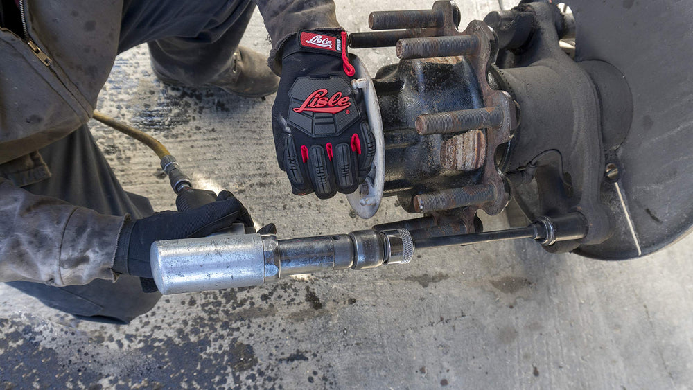 Lisle 29090 in use on truck anchor pin, speeds bushing removal safely