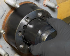 Lisle 31620 socket engaged on a dual rear wheel hub demonstrating precise fit