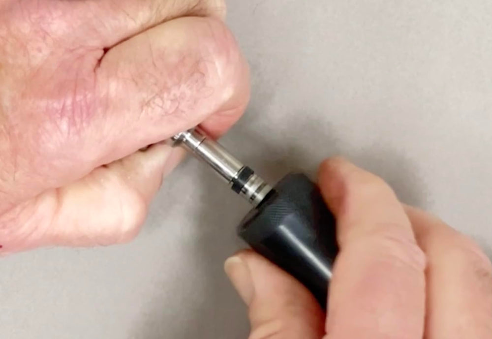 Lisle close-up of pilot cone and sizer on injector tip demonstrating precise seal alignment