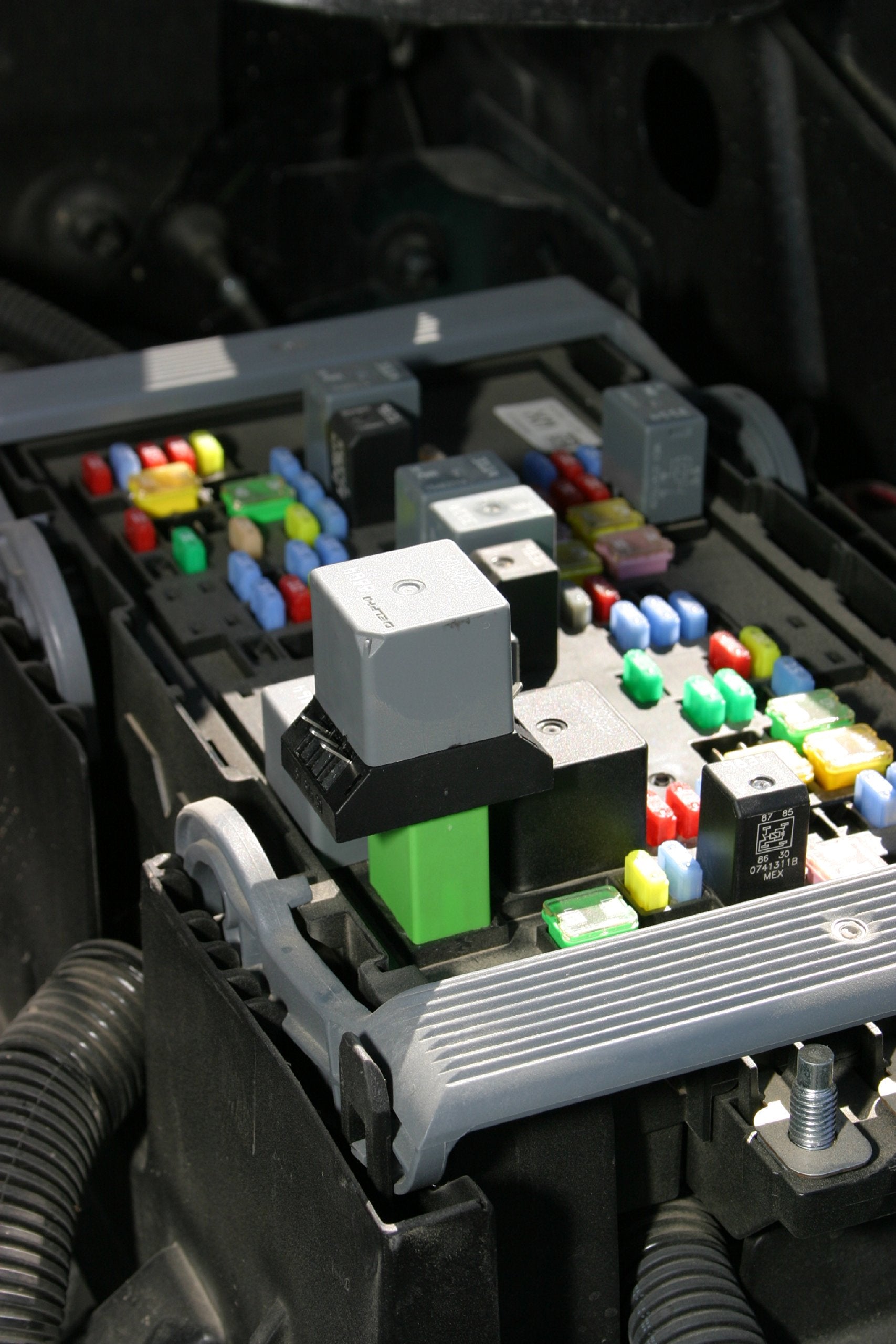 Lisle jumper inserted into relay socket demonstrating hands-on testing and safer diagnostics