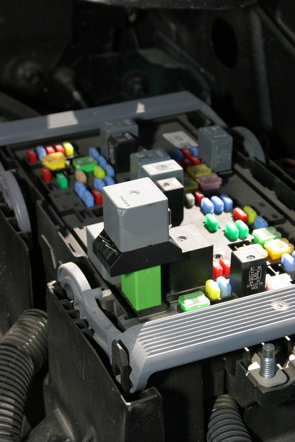 Lisle jumper inserted into relay socket demonstrating hands-on testing and safer diagnostics