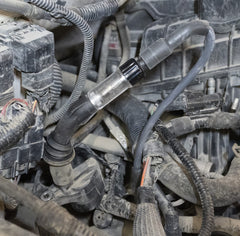 Lisle tester in engine bay with extension reaching recessed coil benefit
