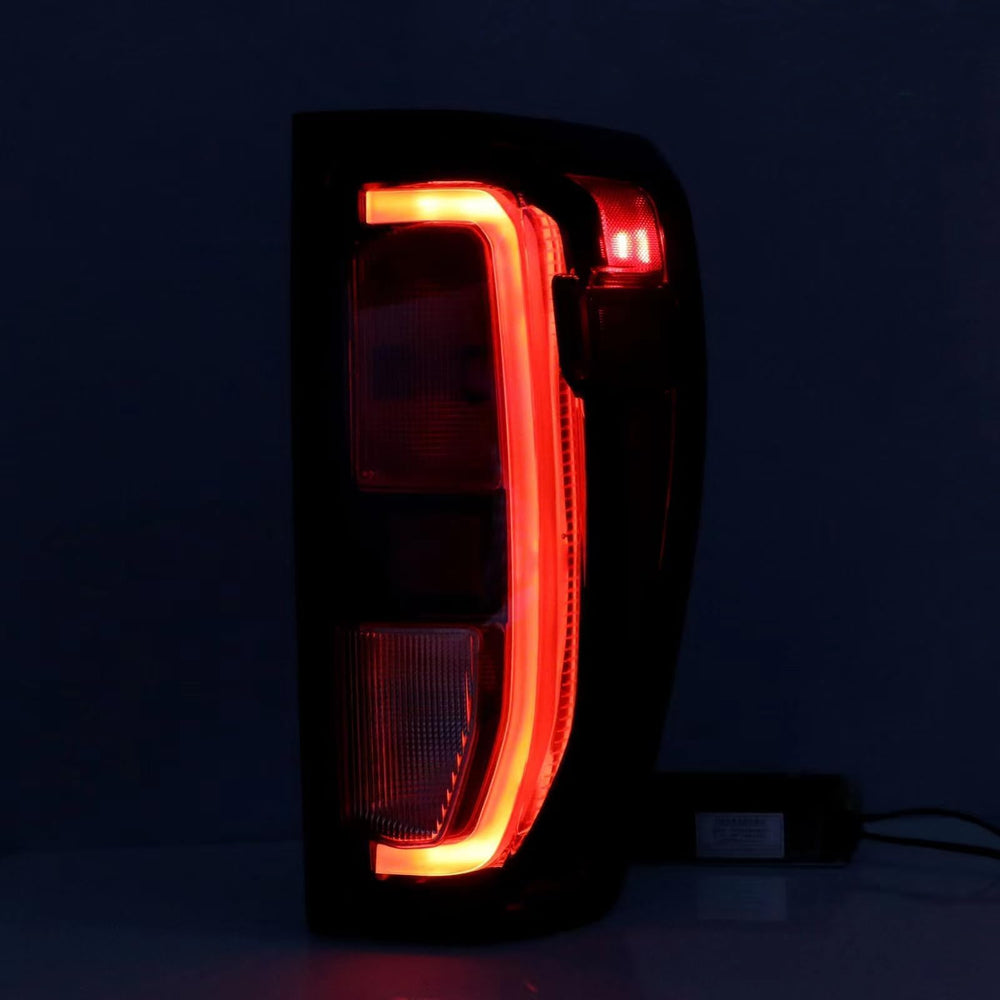 Lochnchn tail light displayed with ruler for accurate size reference