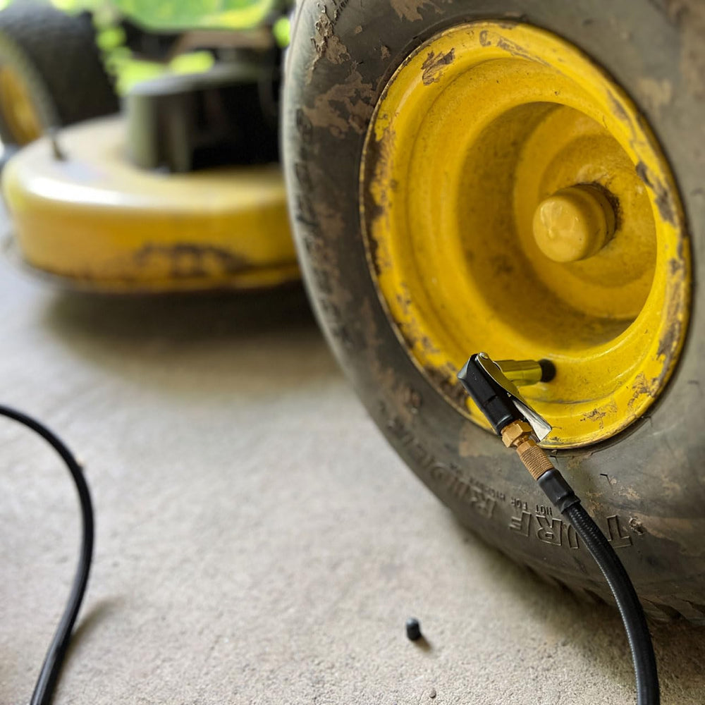 LockNFlate in a garage setting with inflator and gauge highlighting professional-ready use
