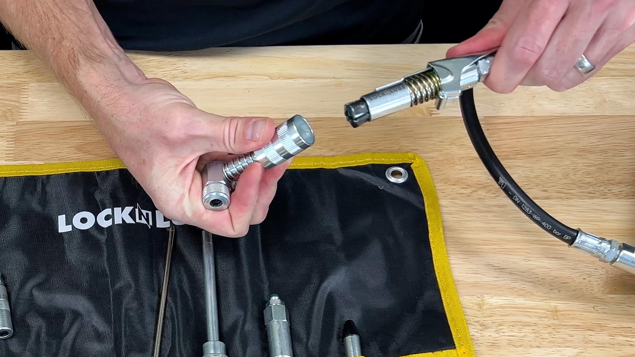 LockNLube case hanging on pegboard for organized, accessible storage