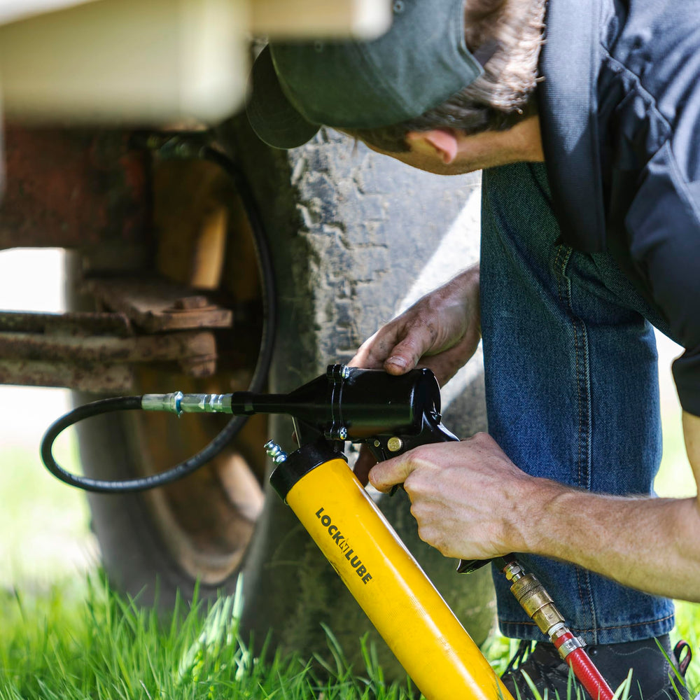 LockNLube grease gun in use delivering continuous flow to a bearing for speed