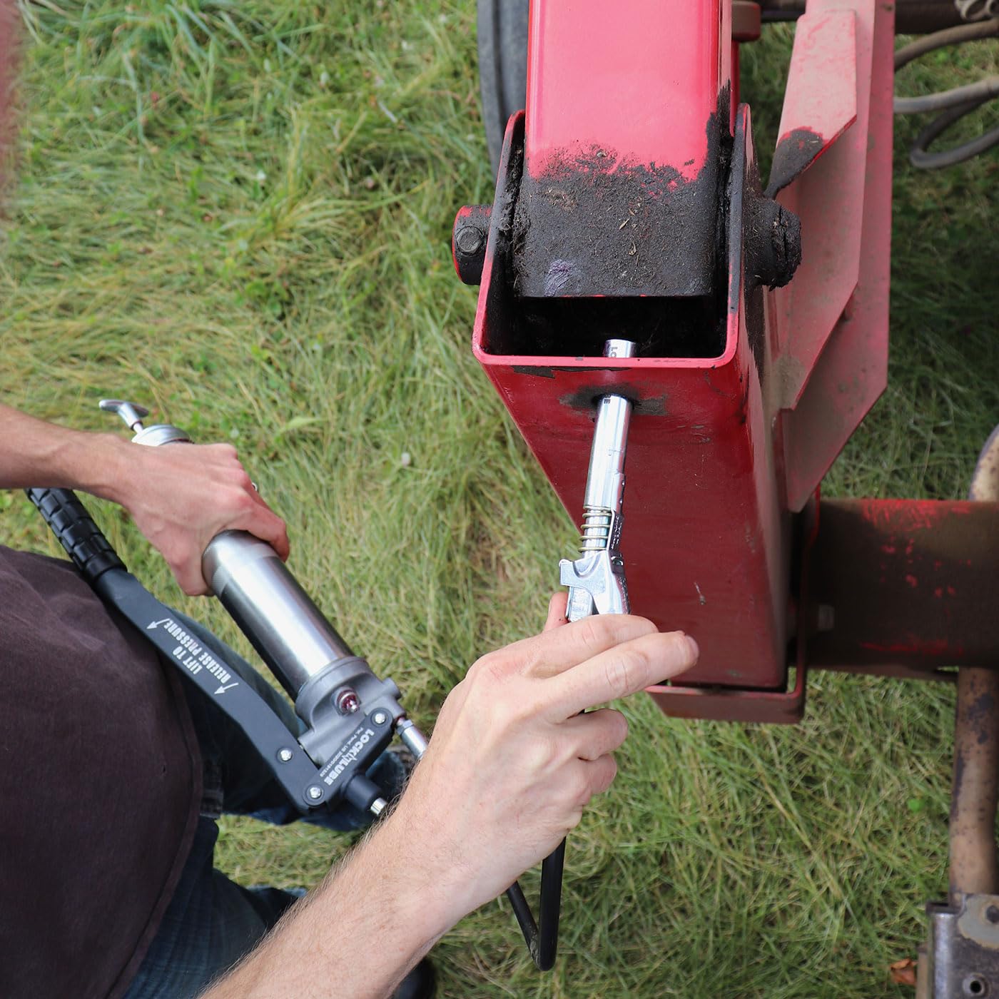 LockNLube attached to grease gun demonstrating secure connection benefit