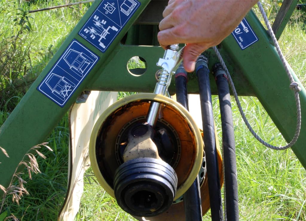 LockNLube next to ruler for scale showing compact extra-reach advantage