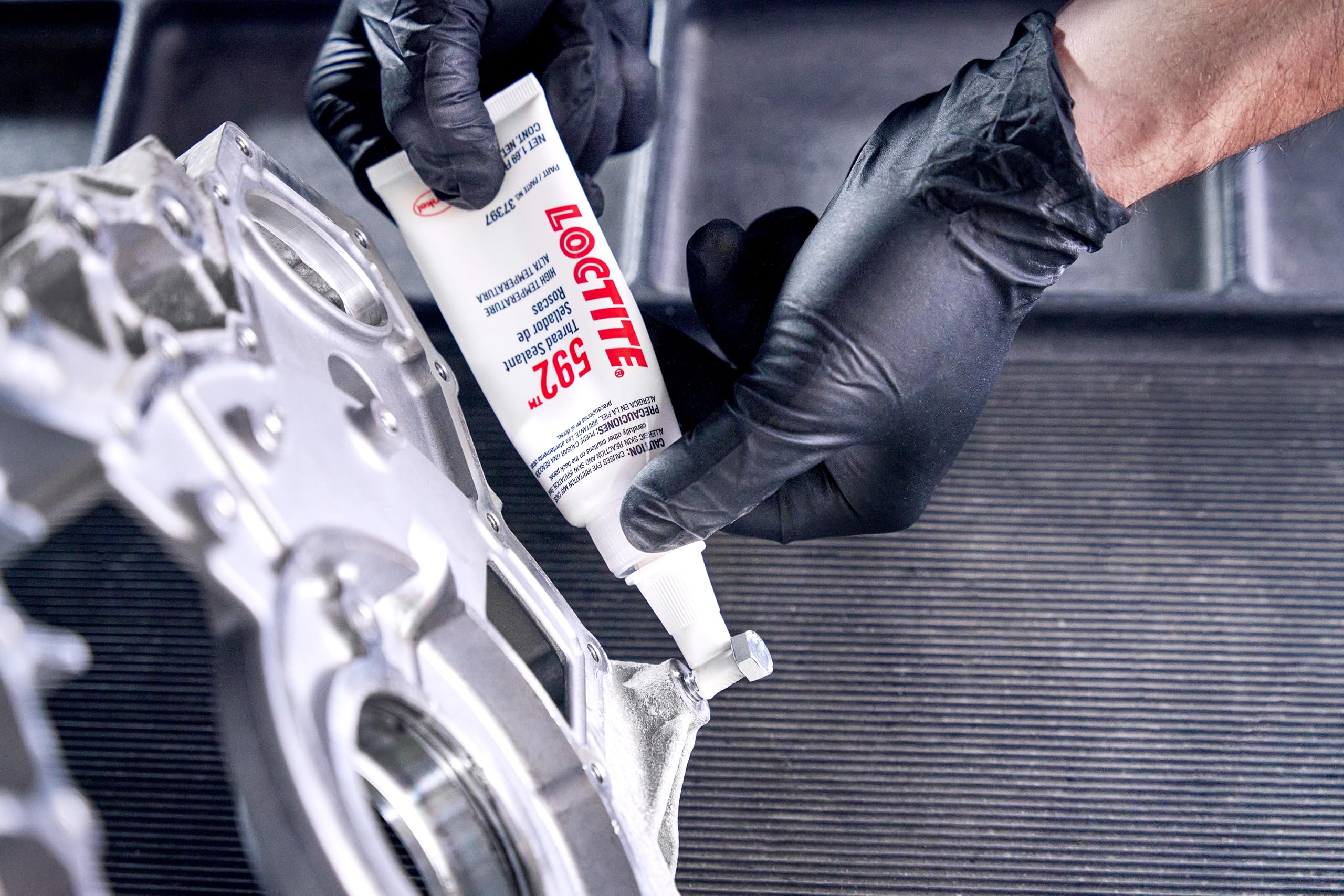Loctite 592 in a garage setup with fittings showcasing professional-grade use