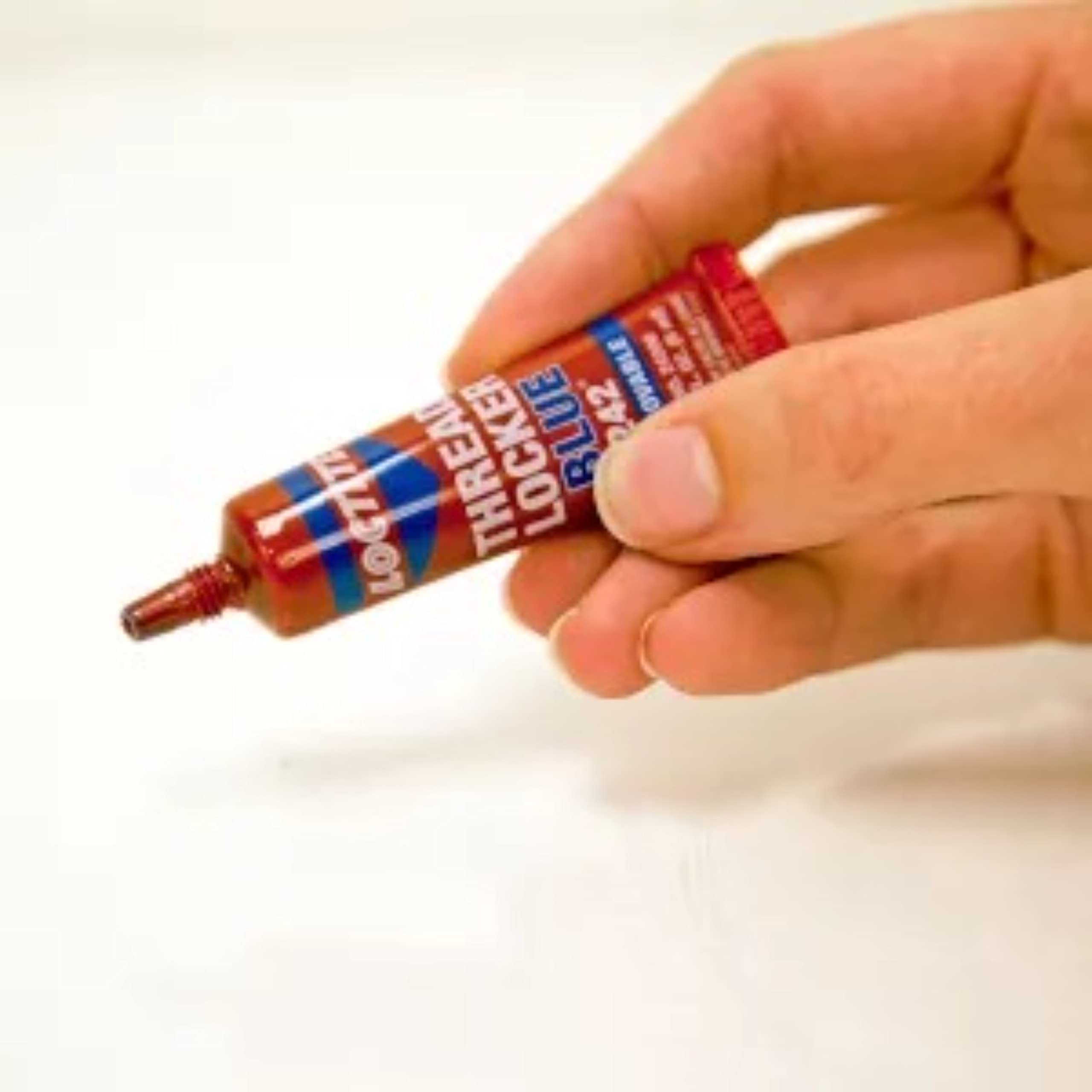 Loctite applied inside a small motor assembly for reliable thread sealing