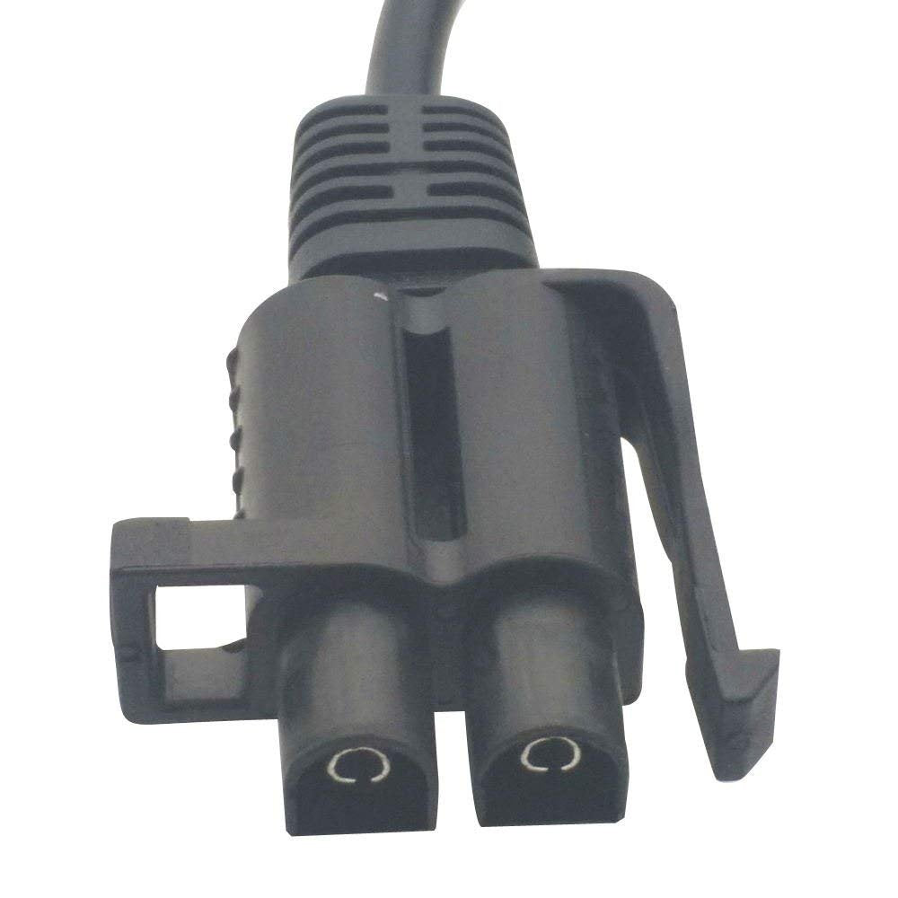 LS charger plugged into a ride‑on vehicle port to demonstrate in‑use convenience