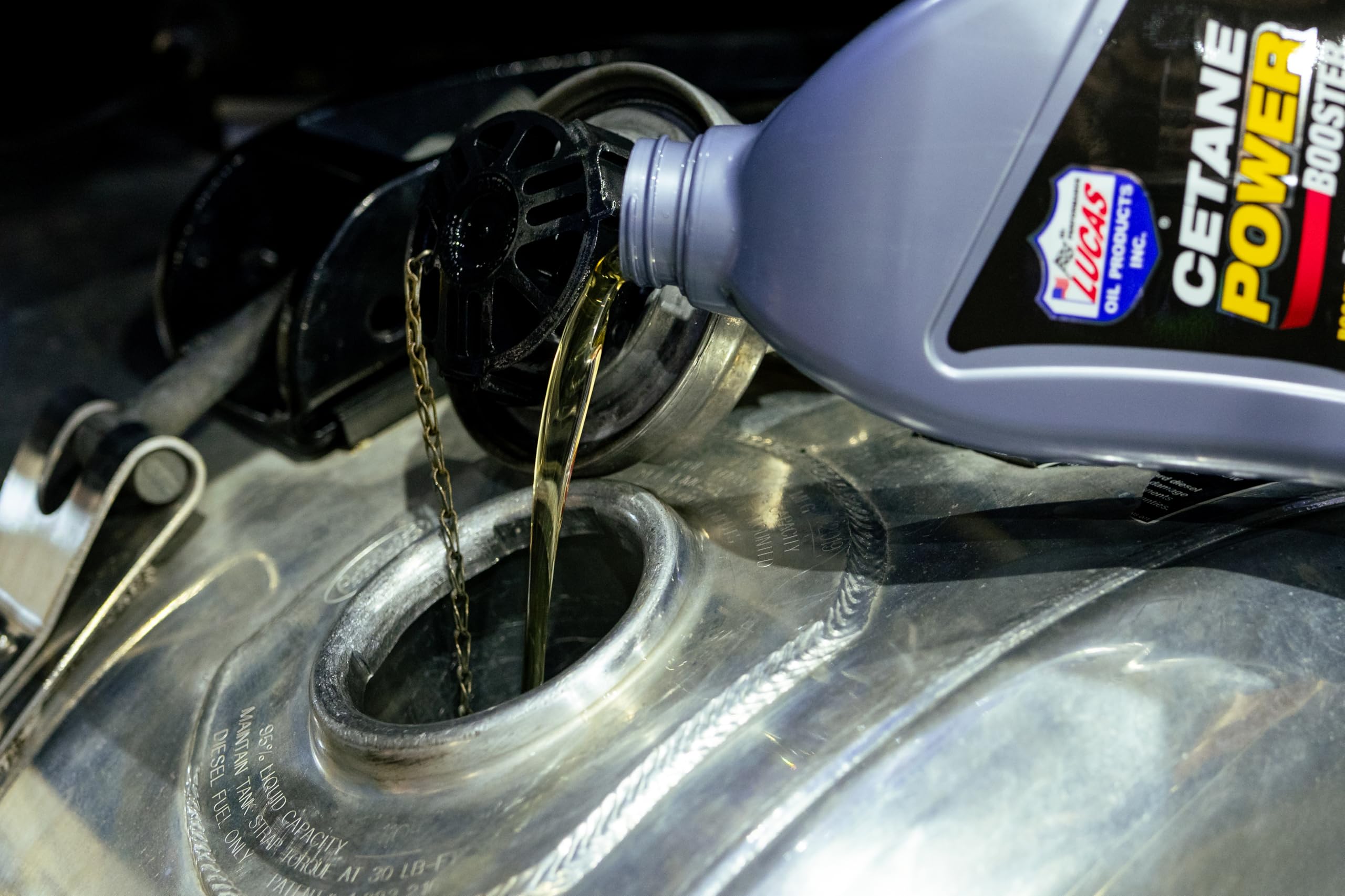 Lucas Oil liquid close-up illustrating smooth formula and injector protection