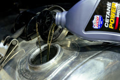 Lucas Oil liquid close-up illustrating smooth formula and injector protection