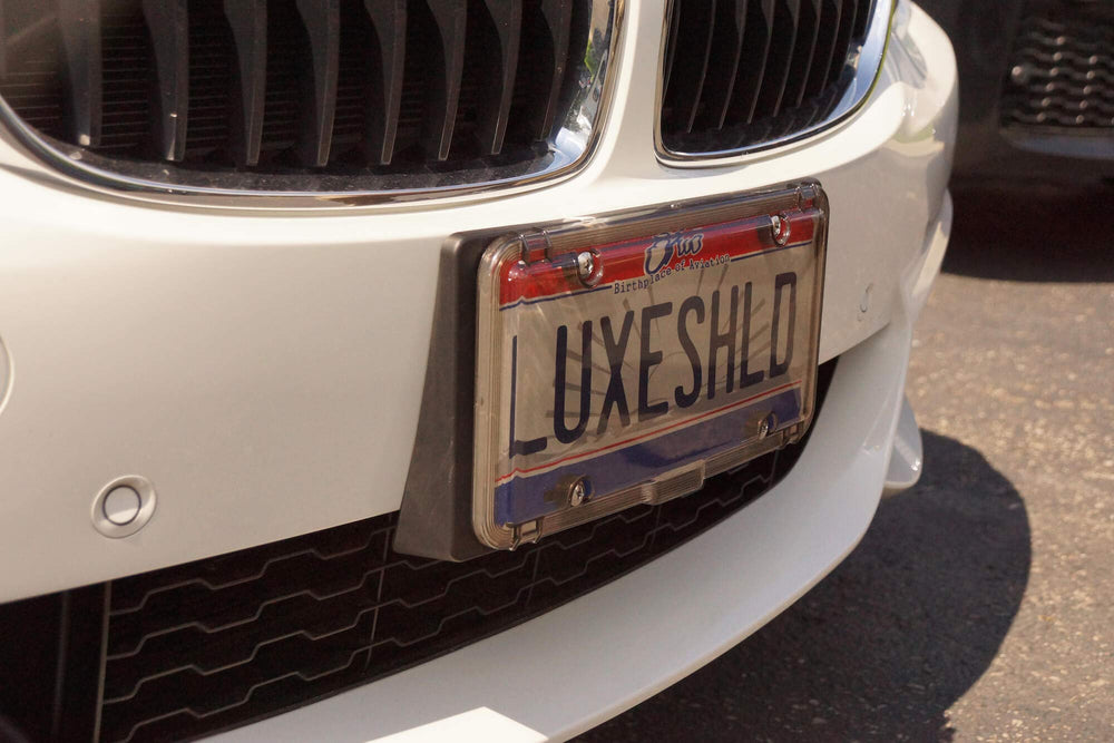 Luxe Shield lifestyle driveway shot adding stylish vehicle protection