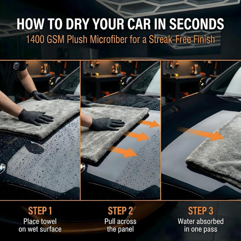 LUXORA AUTO towel beside a hand to show 36x24 inch size for large coverage