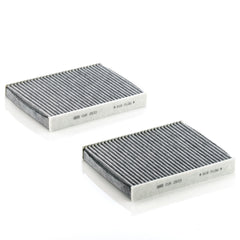 Mann Filter charcoal layer closeup showing activated carbon pores for gas adsorption
