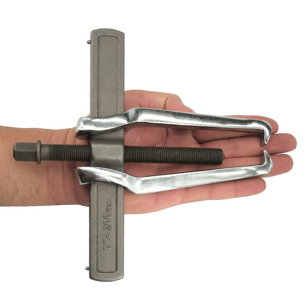 MANNIFEN tool in use on motorcycle flywheel showing safe extraction benefit