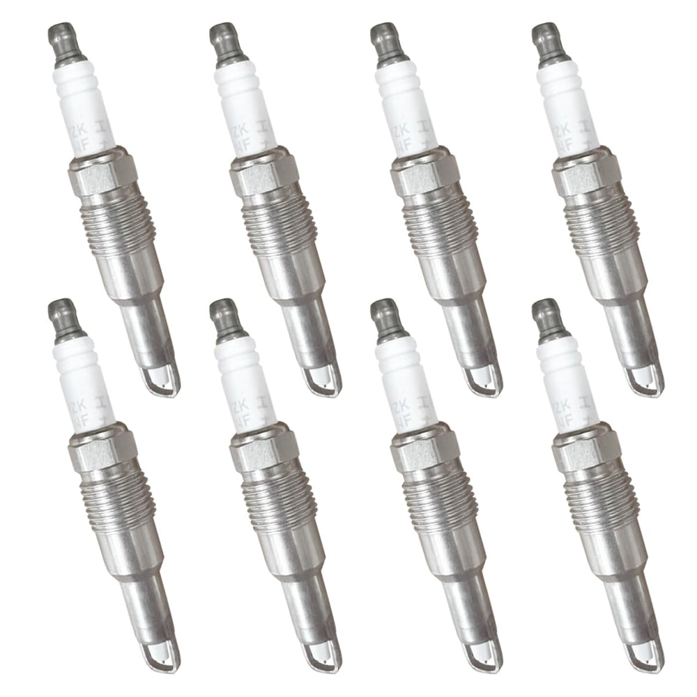 MAS coil and spark plug next to a ruler showing scale for easy identification and comparison