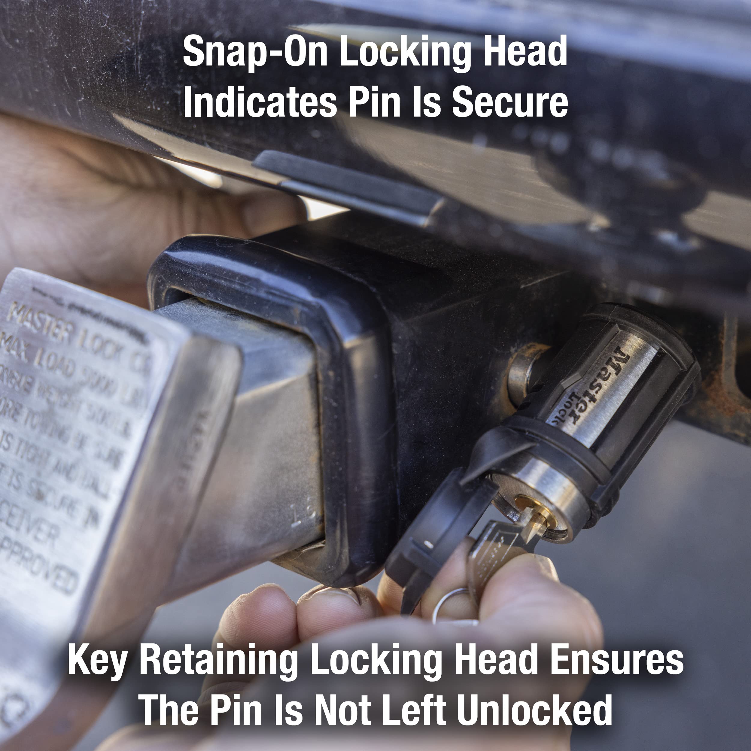 Master Lock installed on trailer receiver demonstrating secure fit in 5/8 inch receiver for theft deterrence