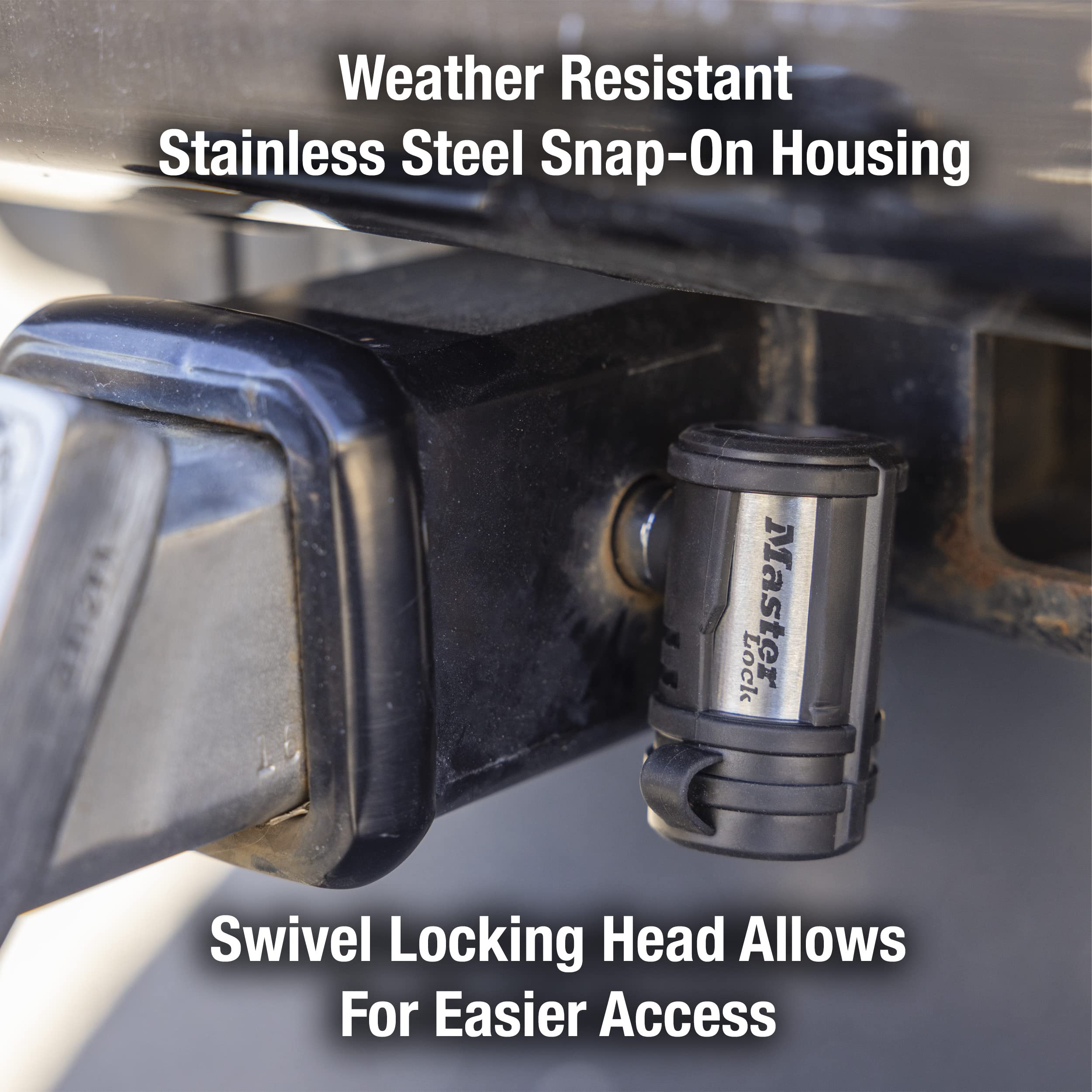 Master Lock mounted on coupler latch illustrating snug attachment and weather-resistant components