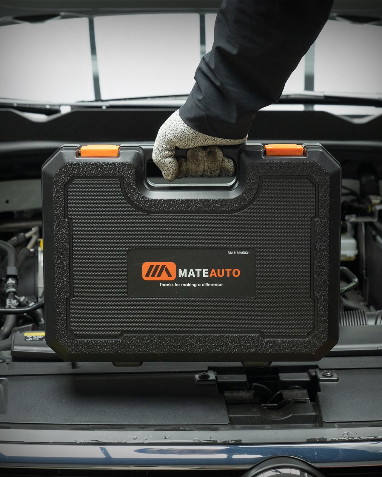 MateAuto case held by hand showing kit scale and easy transport between jobsites