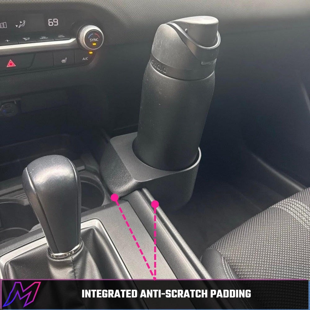 MATERIUM in use with driver inserting bottle, easy tool-free install