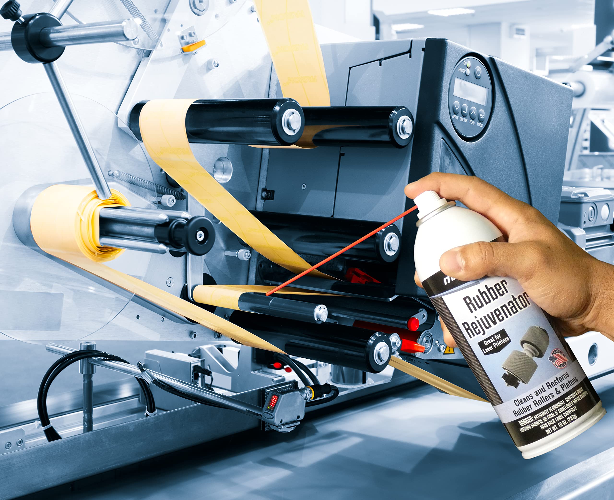 Max Pro being sprayed onto a printer roller to reduce paper jams and slips