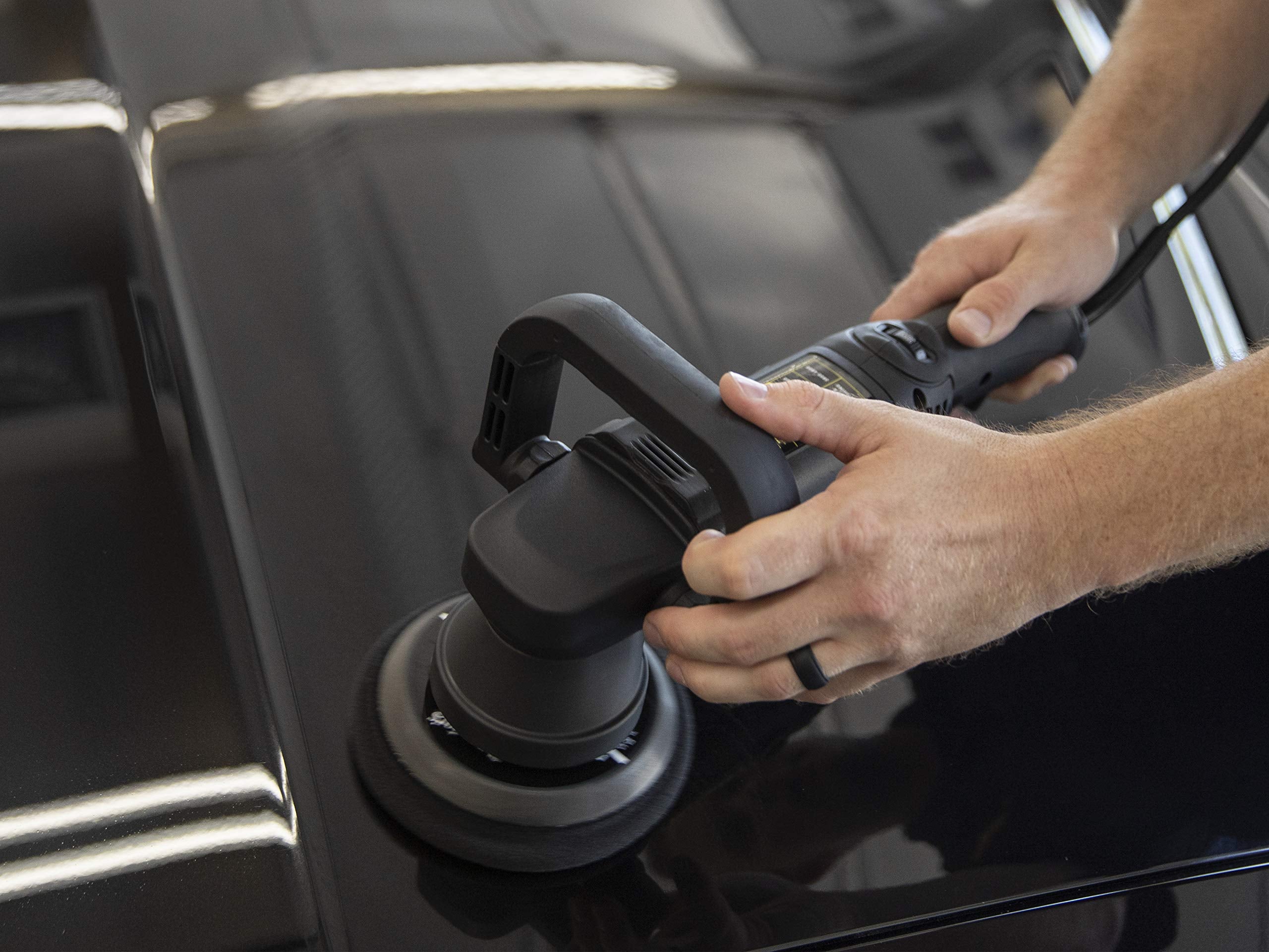 Meguiar's bottle held in hand showing 16 oz scale and portable convenience