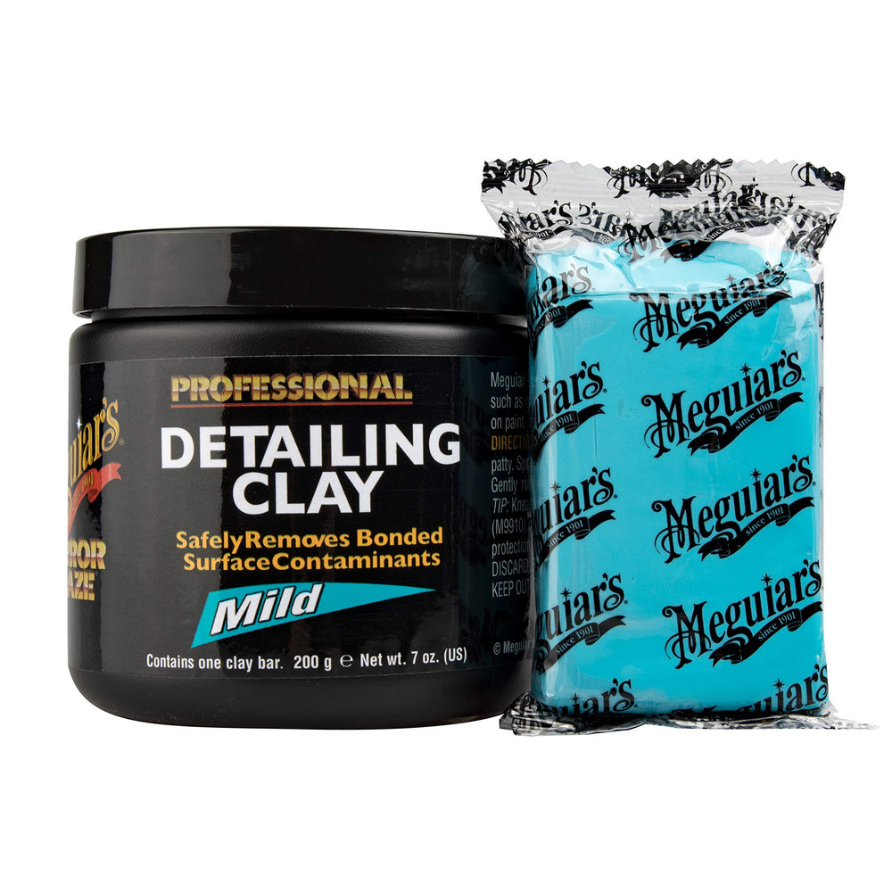 Meguiar's clay puck close-up revealing texture and pliability for safe contaminant removal