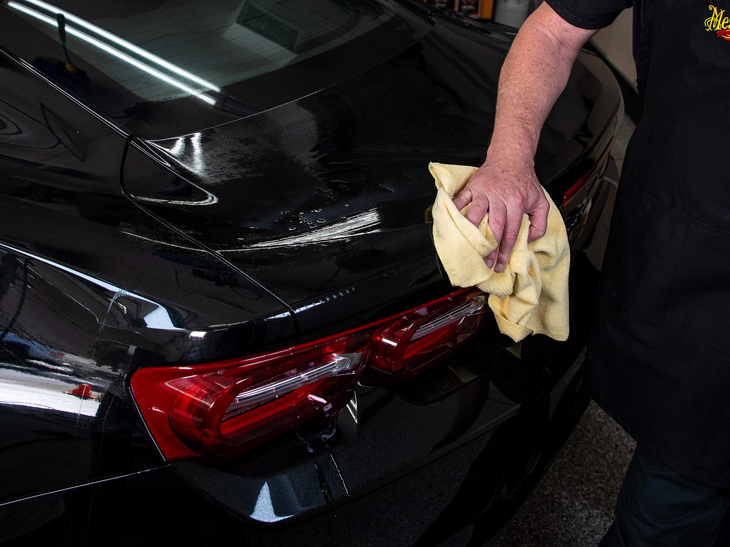 Car exterior reflecting light after Meguiar's clay use illustrating showroom-like finish